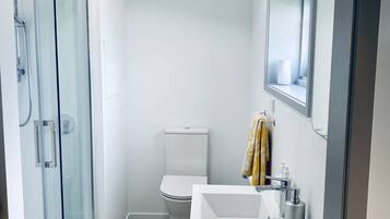 Shower, hair dryer, towels, soap