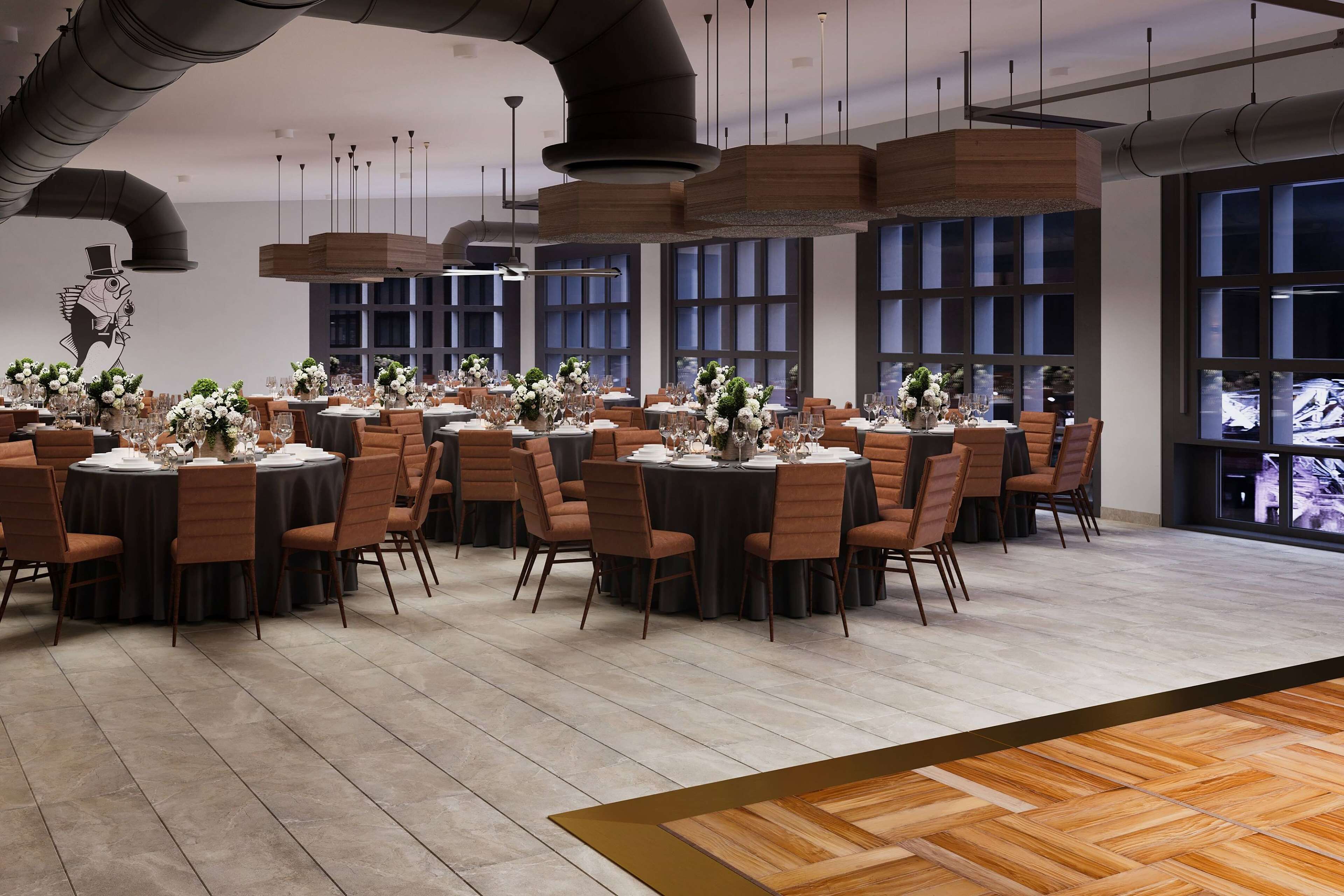 A modern dining area with round tables, brown chairs, and large windows.