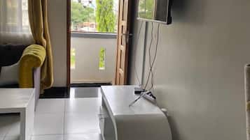 Comfort Apartment | Living area | 24-inch Smart TV with digital channels
