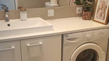 Hair dryer, towels, soap, shampoo
