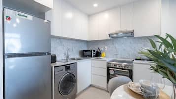 Luxury Apartment | Private kitchen | Full-size fridge, microwave, oven, toaster