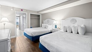 A hotel room with two beds, a desk, and a walk-in closet. - Beachy Oceanfront Suite 5th Flr With Breakfast (Myrtle Beach)