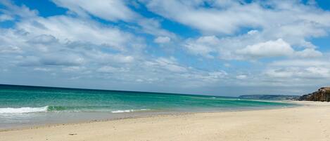 On the beach, sun-loungers