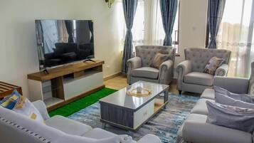 Executive Apartment | Living area | Flat-screen TV