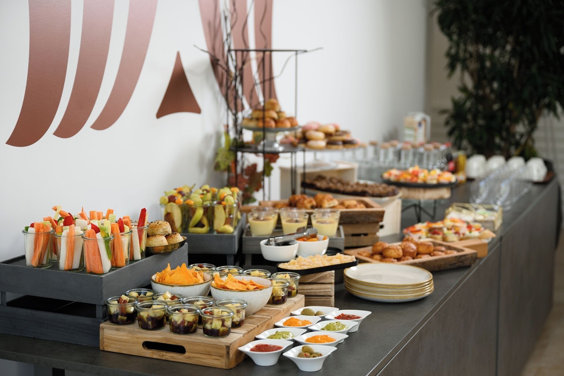 A buffet with various food items and condiments.