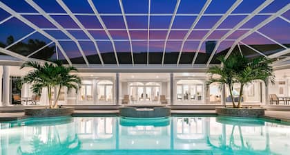 Waterfront home on Marco Island, large pool, & dock. Sleeps 18, many amenities.