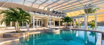 Waterfront home on Marco Island, large pool, & dock. Sleeps 18, many amenities.