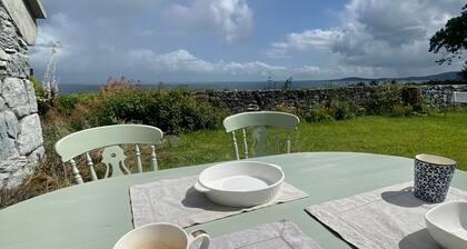 Old Thatch Cottage in the Burren views over Galway Bay on the Wild Atlantic Way