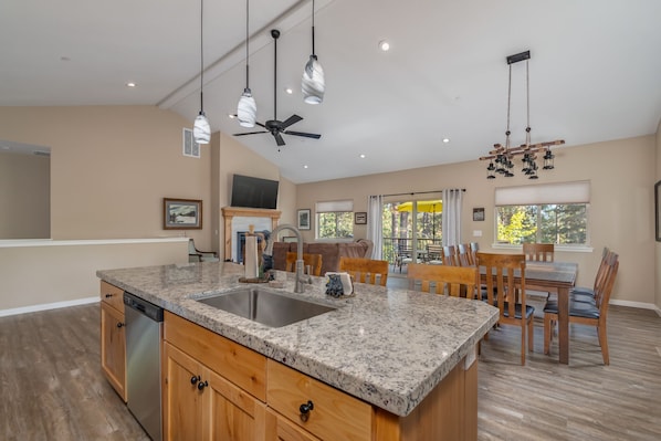 Enjoy cooking in this well-equipped kitchen with a double sink and granite countertop.