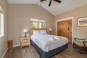 Cozy retreat with a large bed, bedside tables, and a wardrobe.