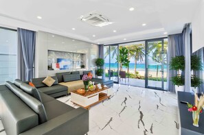 Panoramic Villa, 4 Bedrooms, Private Pool, Sea View | Living area | Flat-screen TV, toys - The Ocean Suites (Da Nang)