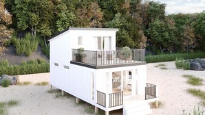 A two-story beach house with a balcony, situated on a sandy beach with trees in the background. - Hideaway Bay Resort (Silver Creek)