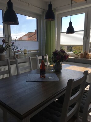 Enjoy a romantic dinner for two in this stylish dining area with a bottle of wine and a beautiful view.