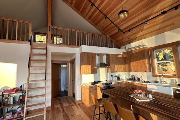 Kitchen and ladder stair to loft bedroom