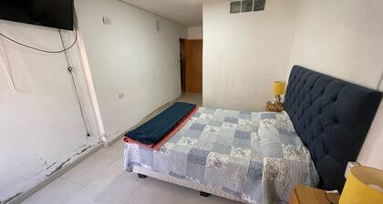 A bedroom and a bathroom