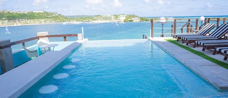 Outdoor pool, open 7:00 AM to 7:00 PM, pool umbrellas, pool loungers
