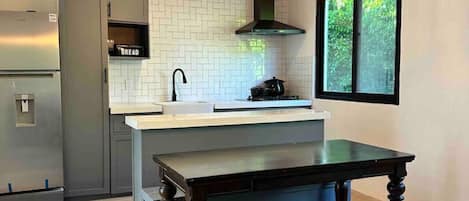 Fridge, microwave, stovetop, coffee/tea maker