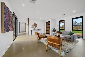 Deluxe House | Living area | Flat-screen TV, fireplace