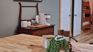 A kitchen with a marble countertop, a framed sign on the wall, and a door in the background. - LakeWay II- 4 min from US-41 and Lake Sullivan (Sullivan)