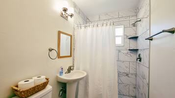 Shower, hair dryer, towels, soap