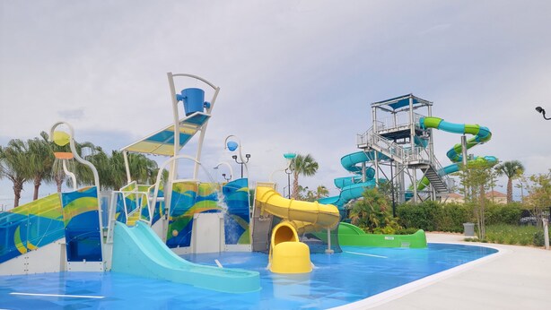 A water park with multiple slides and water features. - Disney World/Private Swimming Pool, 5bed/5bath 5mins away to Oasis Club
 (Davenport)