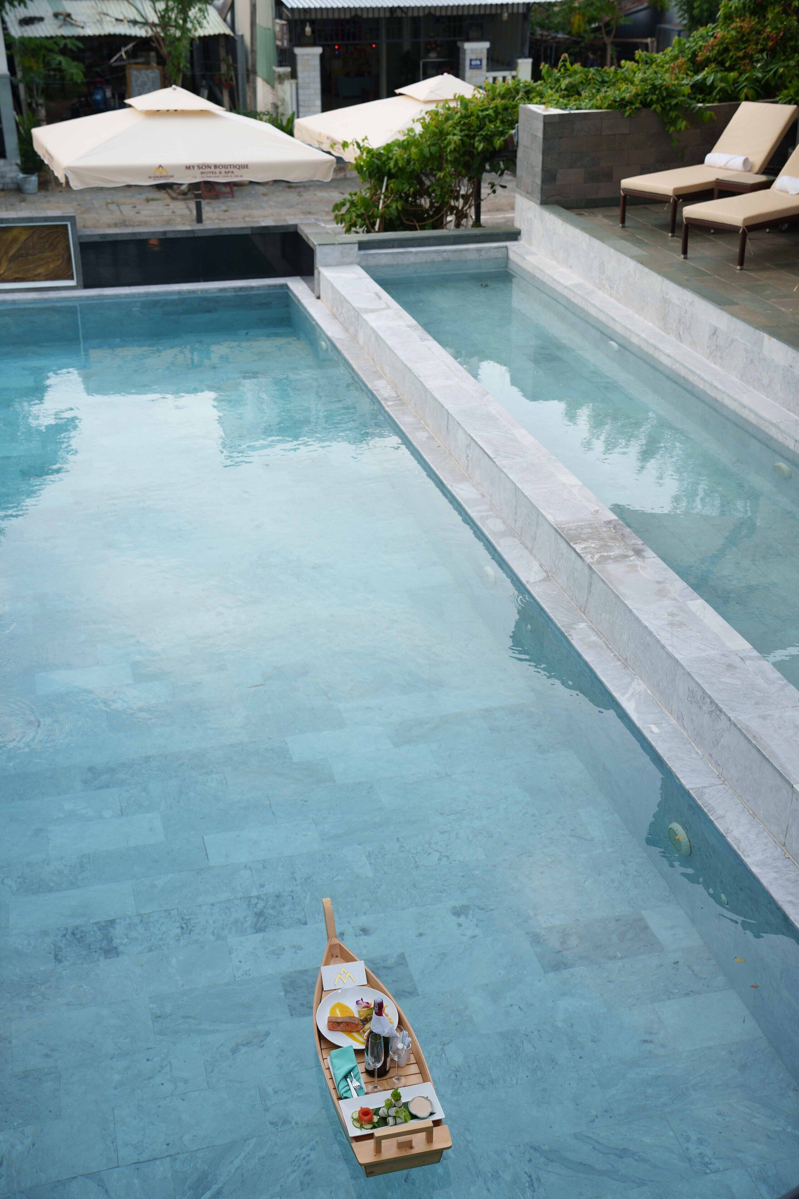 Outdoor pool, open 8:00 AM to 8:00 PM, pool umbrellas, pool loungers