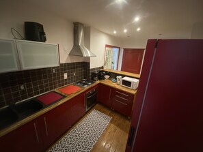 Fridge, microwave, oven, cookware/dishes/utensils