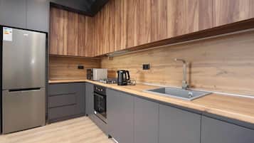 Family Apartment | Private kitchen | Fridge, microwave, oven, stovetop