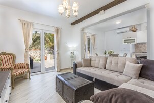 Luxury Apartment With Swimming Pool | Living area | 110-cm Smart TV with satellite channels, streaming services
