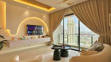 Design Apartment, Multiple Beds, City View | Living area | 50-inch Smart TV with cable channels, Netflix, streaming services