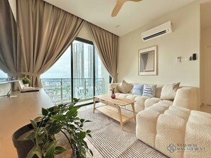 Design Apartment, 3 Bedrooms, Balcony | Living area | 50-inch Smart TV with cable channels, Netflix, streaming services - SKS Pavillion Residences by Stayrene (Johor Bahru)