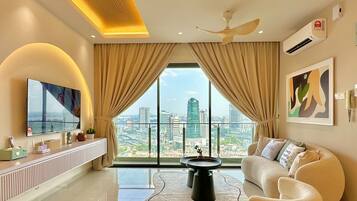 Design Apartment, Multiple Beds, City View | Living area | 50-inch Smart TV with cable channels, Netflix, streaming services