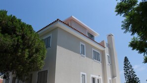 A two-story building with a flat roof and white walls. - Seaview 4 Bedroom villa with pool (Paphos)