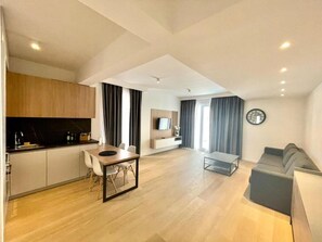 Apartamento superior | Área de estar | TV LCD 32 polegadas com canais a cabo