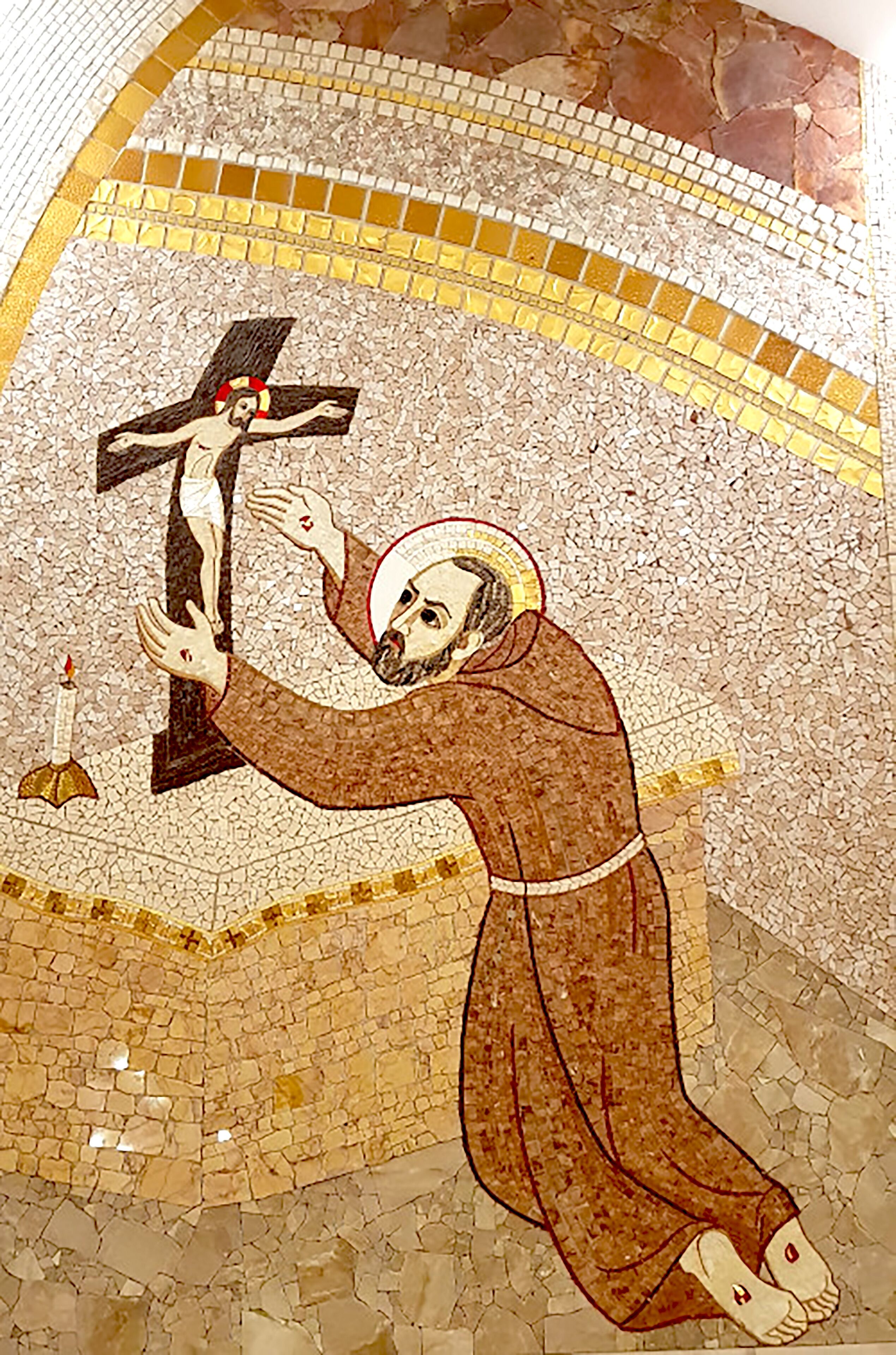 A mosaic depicting a religious scene with a figure holding a cross.