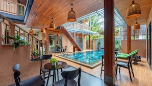Deluxe Triple Room, Pool View | Hypo-allergenic bedding available, minibar, in-room safe, desk - The Linh Seaside Villa Hoi An (Da Nang)