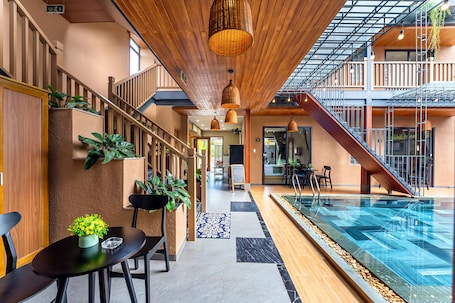 Deluxe Triple Room, Pool View | Hypo-allergenic bedding, minibar, in-room safe, desk. The Linh Seaside Villa Hoi An