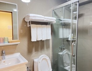 Shower, hair dryer, towels, soap