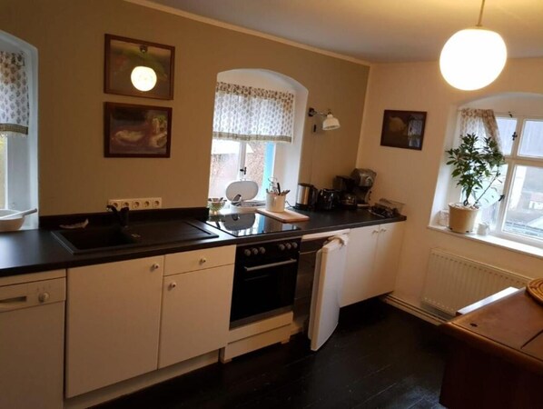 Fridge, electric kettle, toaster, cookware/dishes/utensils
