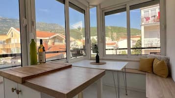 Family Apartment | Private kitchen | Fridge, stovetop, cookware/dishes/utensils, dining tables