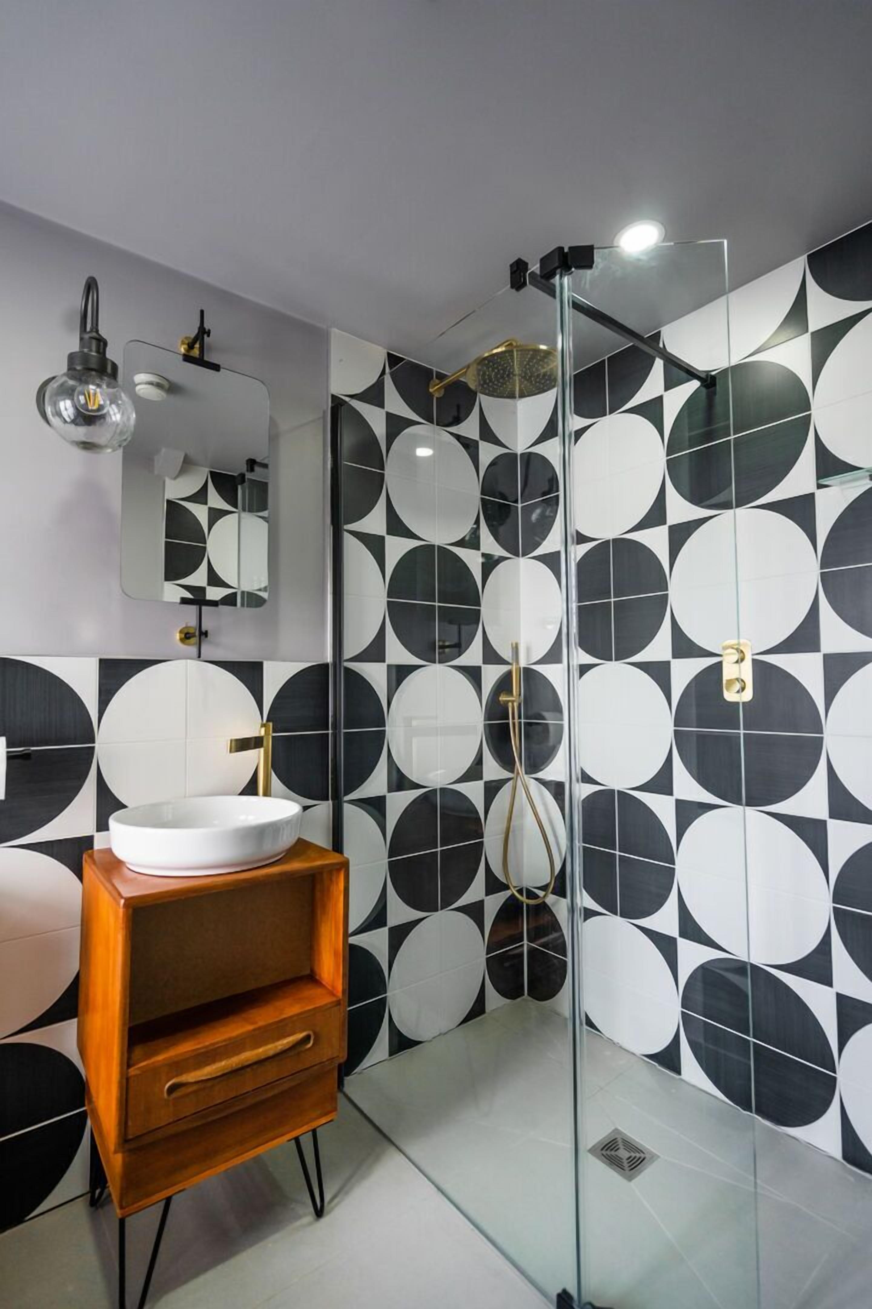 superior room | bathroom | shower, rainfall showerhead, designer toiletries, hair dryer