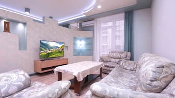 Economy Apartment | Living area | TV