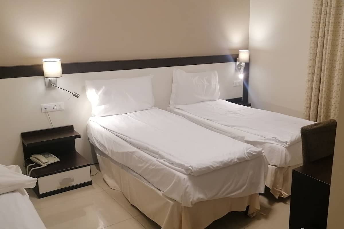 Premium bedding, down comforters, in-room safe, desk