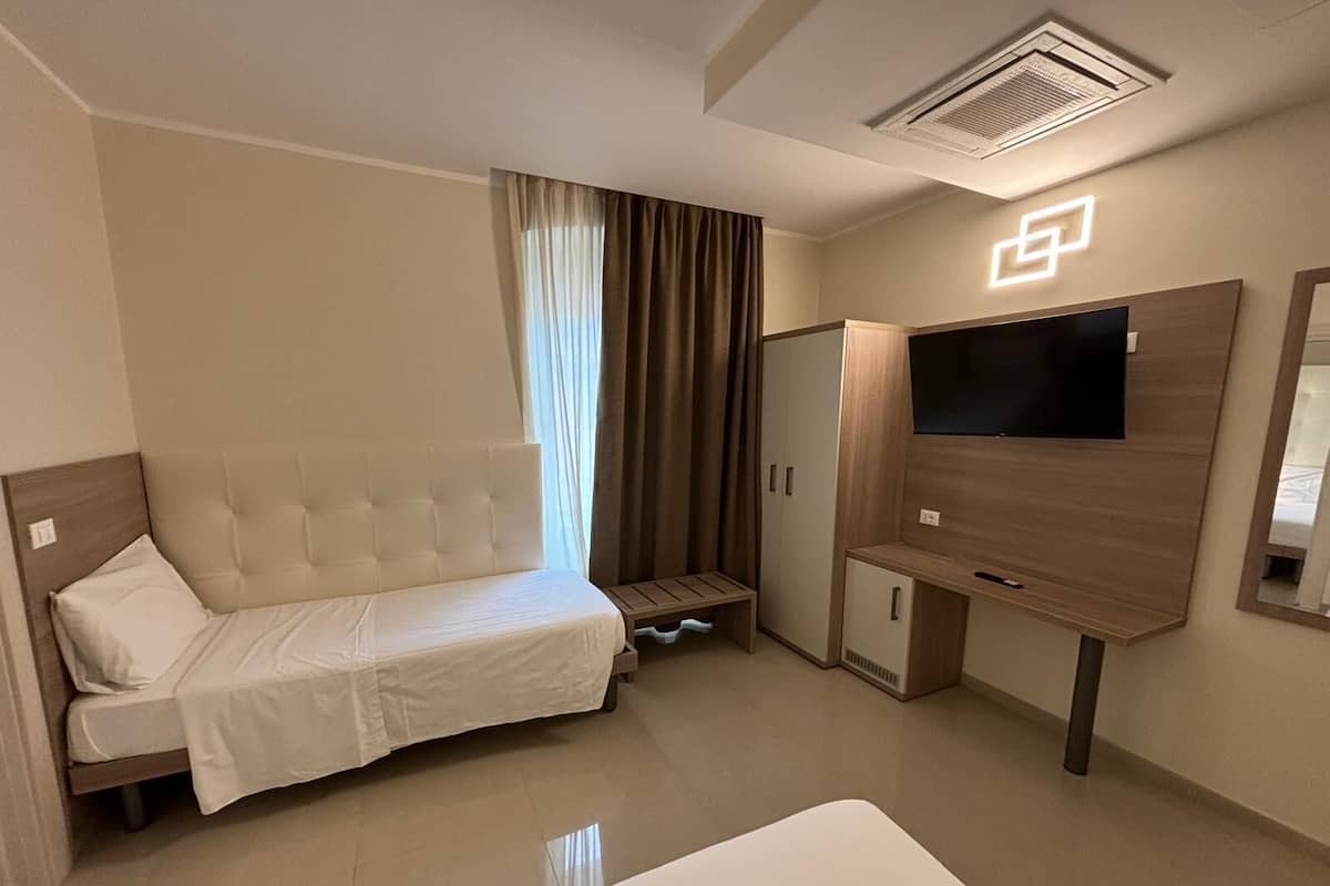 Superior Quadruple Room | Premium bedding, down comforters, in-room safe, desk