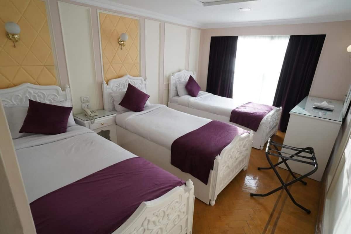 1 habitación, caja de seguridad en la habitación y ropa de cama