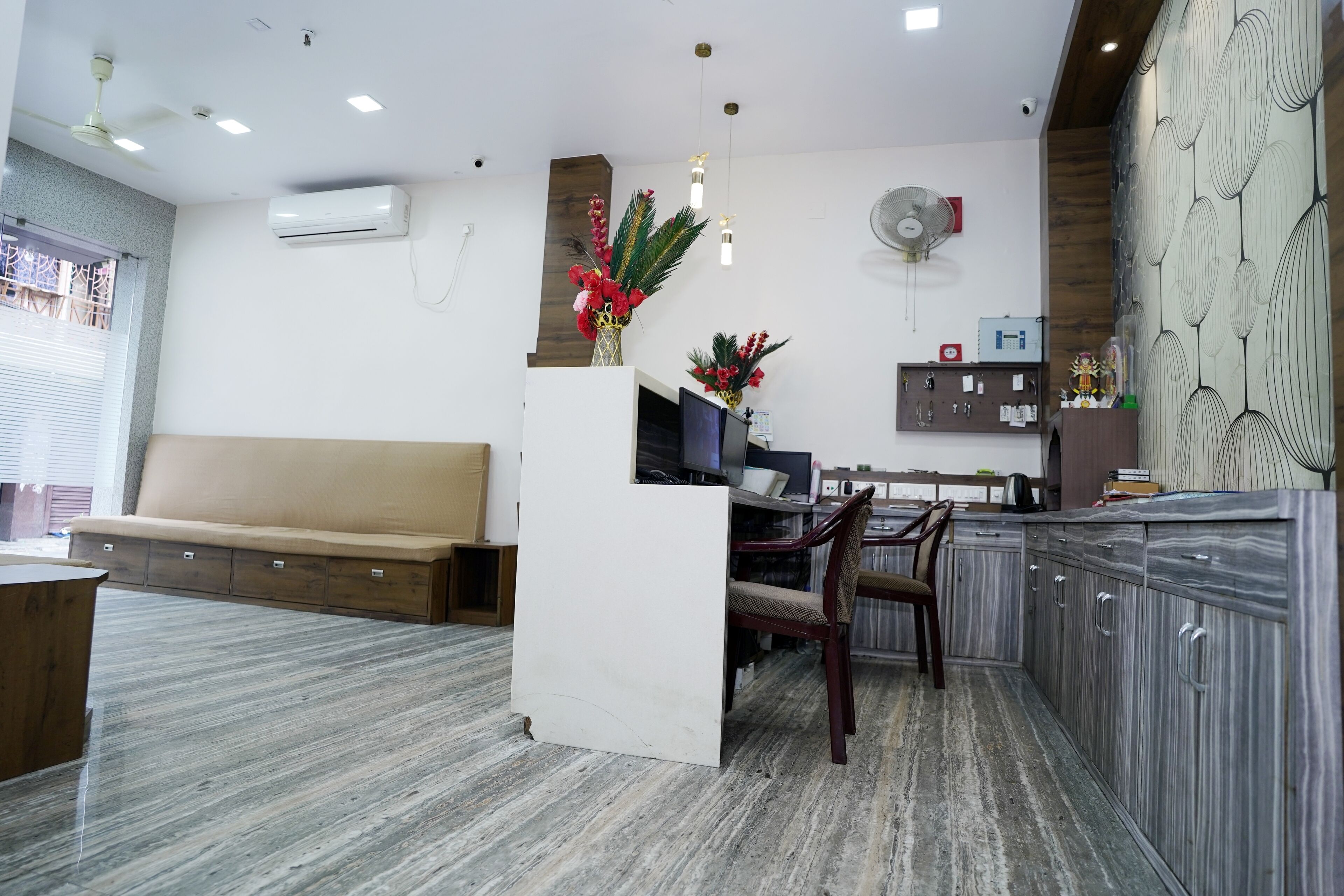 A modern kitchen with a dining area, white cabinetry, and a built-in island.