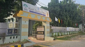 A hotel entrance with a sign for 'Hotel Gaurang Vihar' and a logo for 'Bihar Tourism'. - Arunya Hotel & Resort (Rajgir)