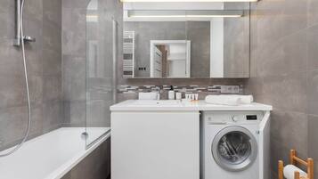 Shower, hair dryer, towels, shampoo