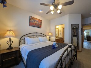 Sink into your comfortable bed with crisp linens and decorative accents, while the ceiling fan keeps you cool throughout the night. - Stylish Lodge with Pool/Hot Tub/Shuttle (Keystone)