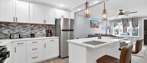 Fridge, microwave, stovetop, coffee/tea maker